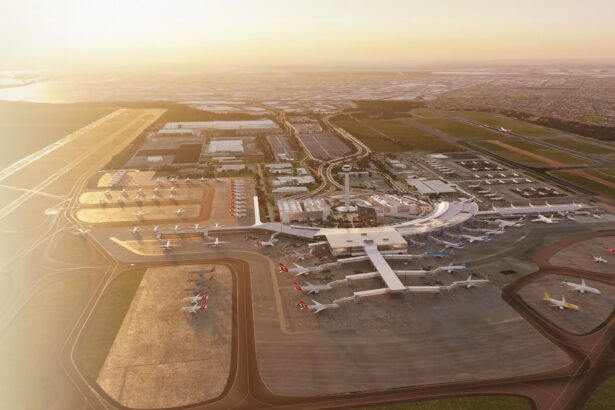Aerial view of an airport terminal with multiple aircraft parked at gates and on surrounding tarmacs.