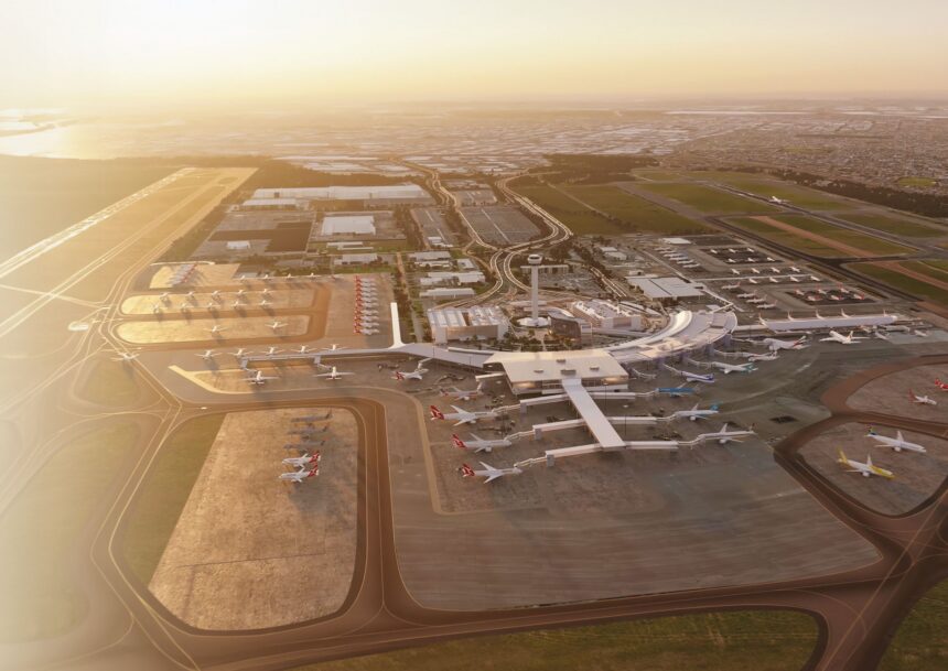 Aerial view of an airport terminal with multiple aircraft parked at gates and on surrounding tarmacs.