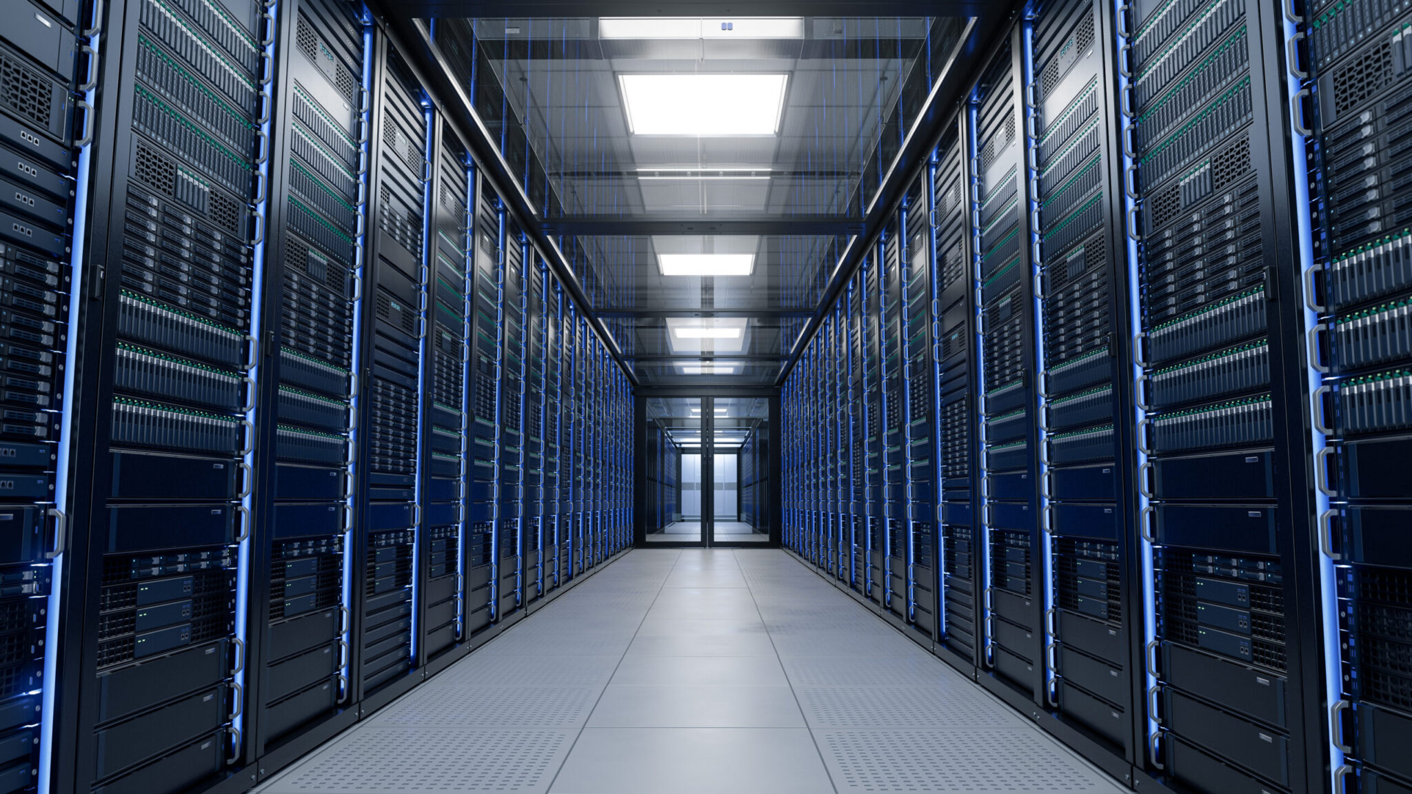 Modern data centre with rows of server racks in a climate-controlled server room.