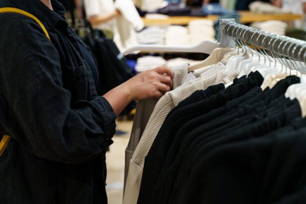A person browsing clothing on a retail rack.