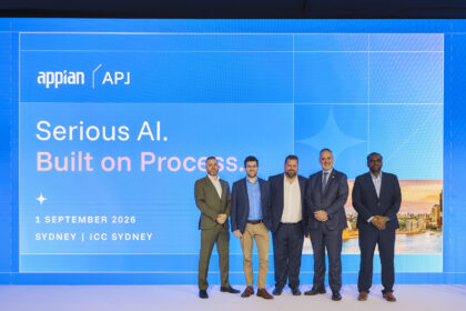 Five men standing on stage at the Appian APJ event in Sydney, in front of a screen displaying “Serious AI. Built on Process.”