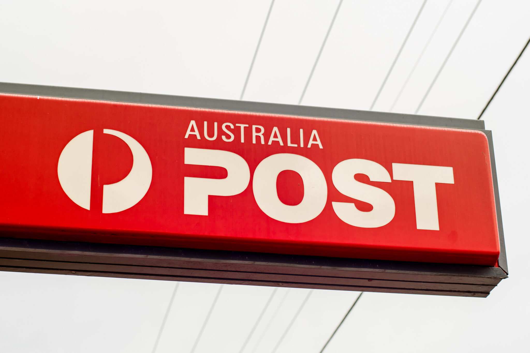 Australia Post Office outside signboard with logo.