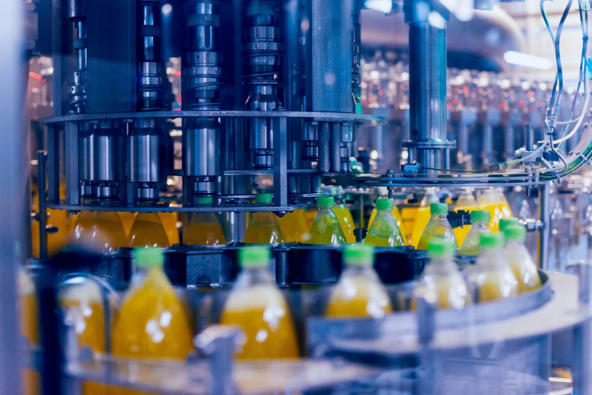 Bottled drinks on a manufacturing conveyor.